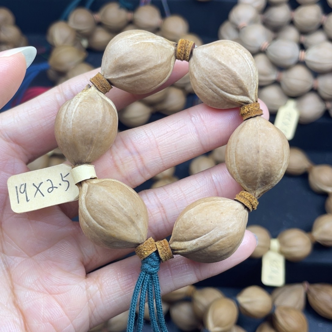 005橄榄核三花手捻19*25