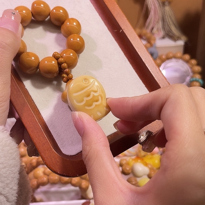 贝***0猴头核桃吊坠猴头屁桃手捻加鱼