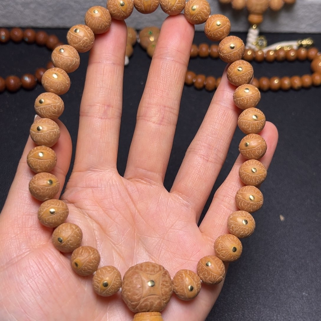 凤眼菩提吊坠11.5mm精品铜钉27颗手持