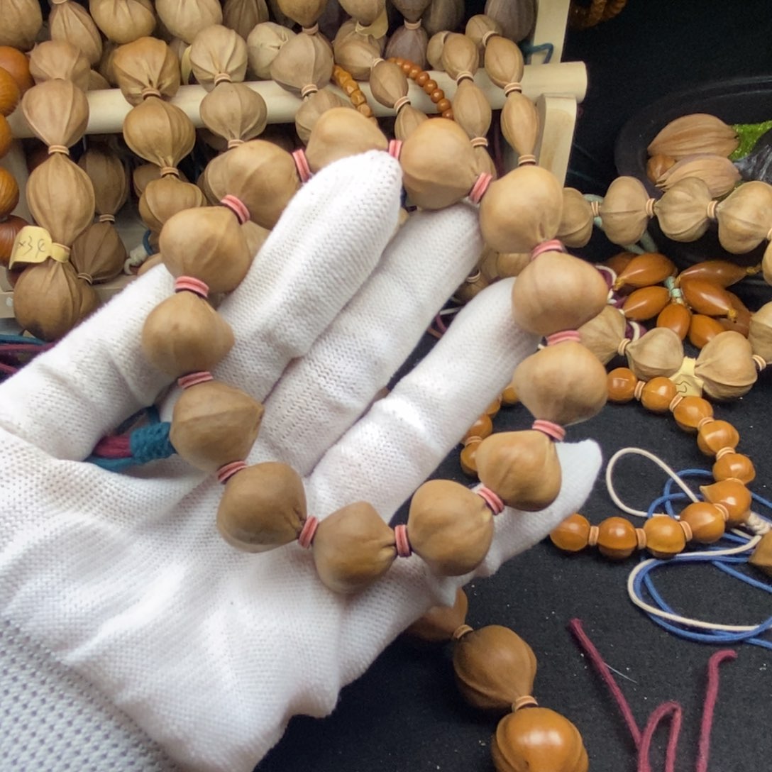 昊***…橄榄核手串/手链1918三花大蒜头13颗