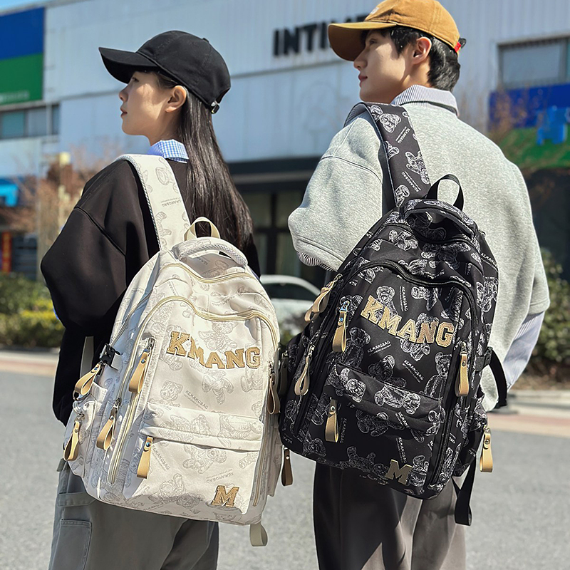 减负书包男生高中生大容量双肩包初中女生印花大学生休闲旅行背包