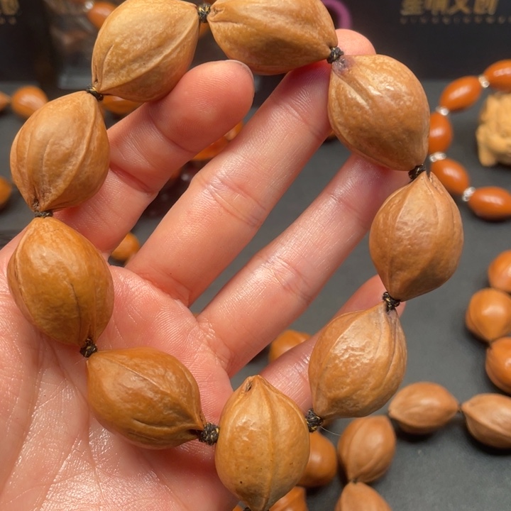 @***。手串/手链橄榄核梅林铁树20.529