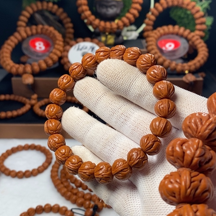 桃核吊坠般*?秦岭龙纹桃核