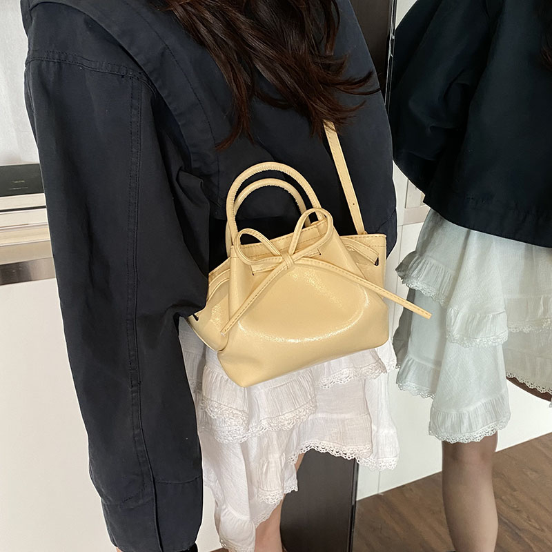 小众手提菜篮子包包女春季2025新款潮时尚水桶包蝴蝶结单肩斜挎包