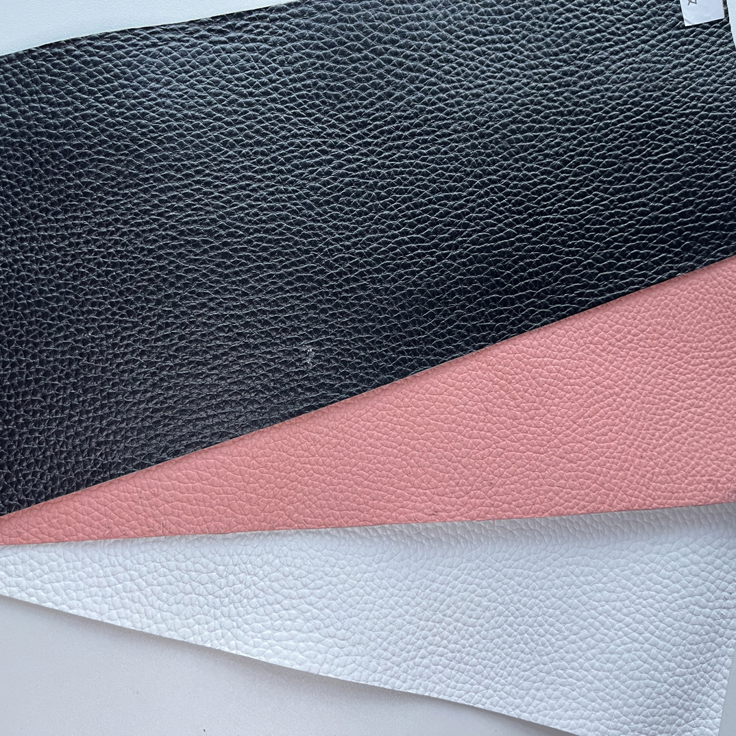 粉色黑色白色荔枝纹质地非常的柔软百分之百真皮