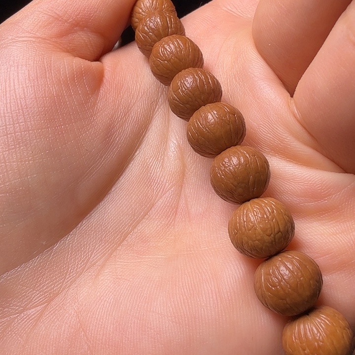 方***缆猴头核桃手串凤羽