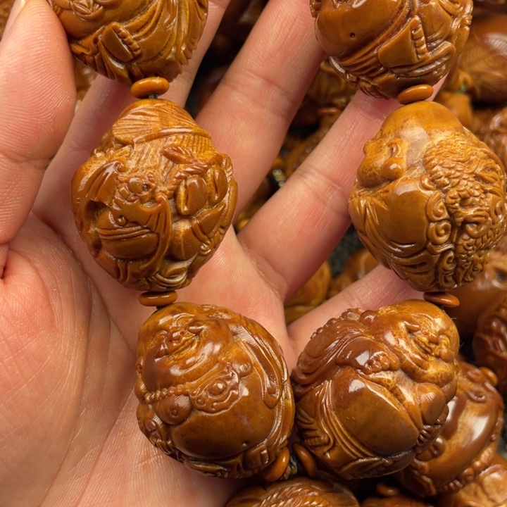 橄榄核吊坠逍*任橄榄核手持