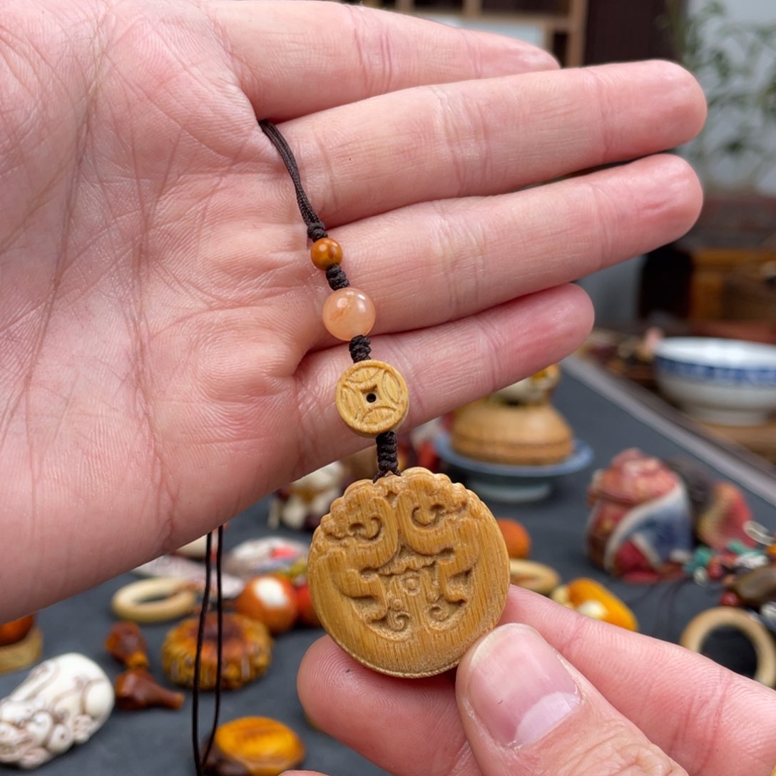 木Y***g方颜竹木艺术吊坠