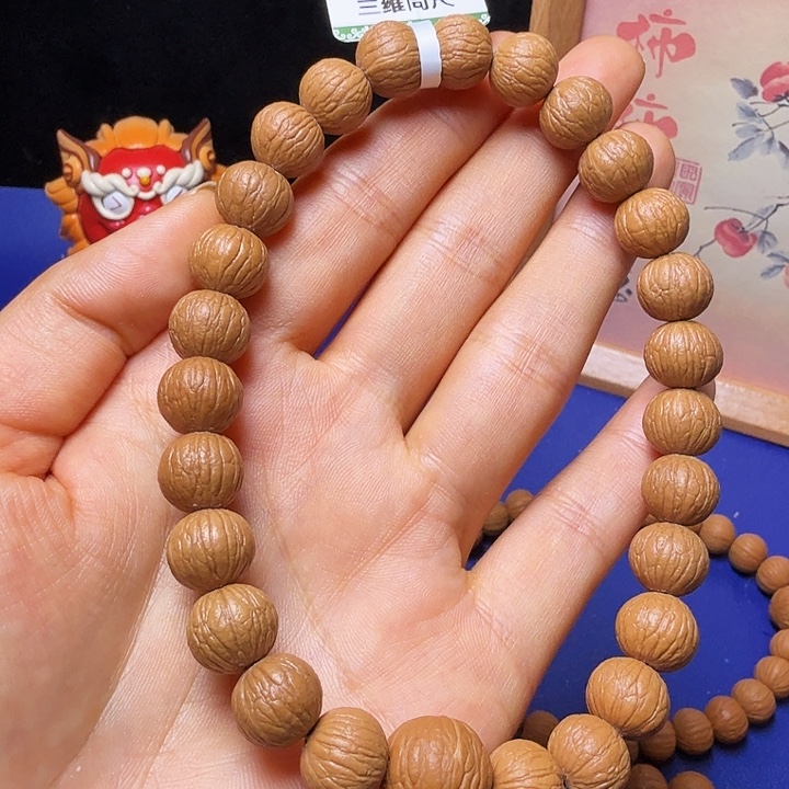 今***虎猴头核桃吊坠凤羽