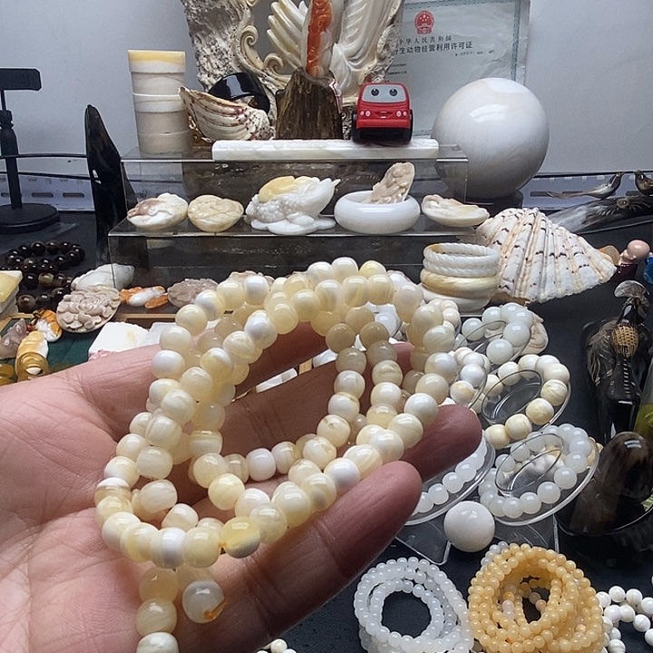 非金属贝壳蜜蜡色老型0.6*0.7多圈