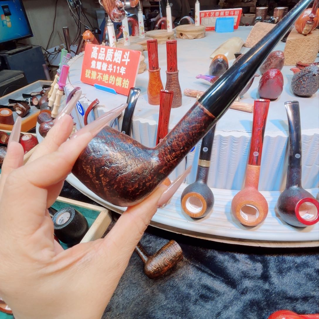 毛*焦耀烟斗一撞球