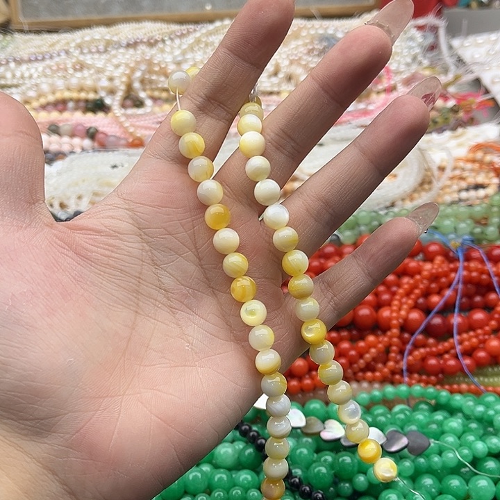 玛瑙/玉髓珠宝半成品未镶嵌一条6mm左右黄蝶贝珠