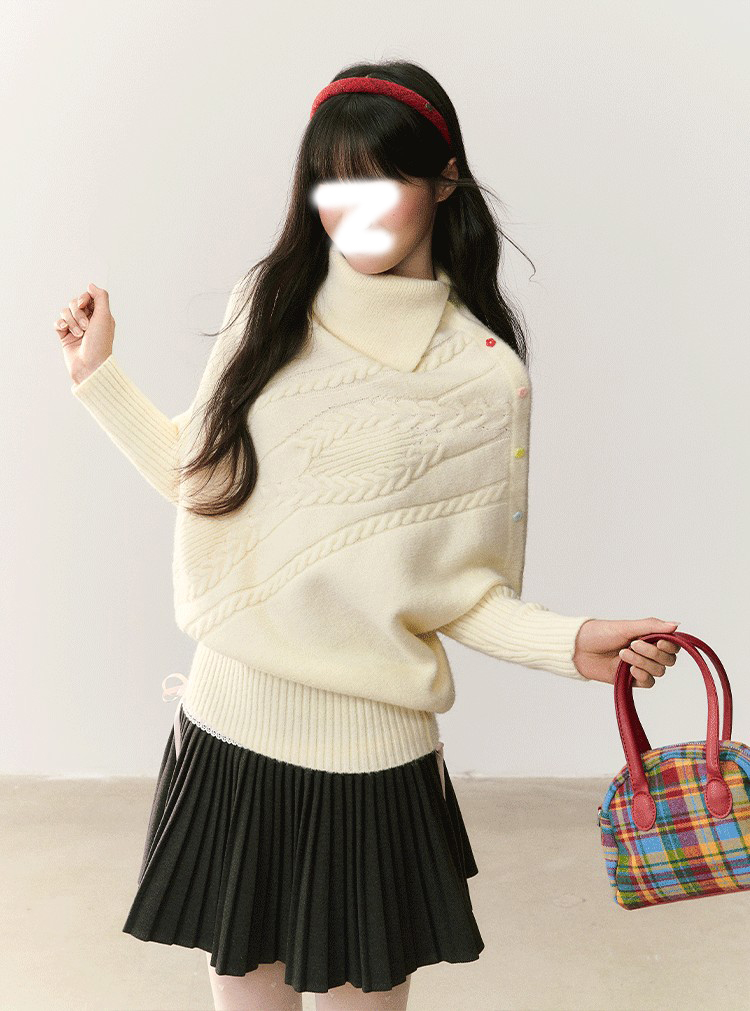 白色绞花宽松上衣女秋冬2025新款收口下摆不对称翻领彩扣斗篷毛衣