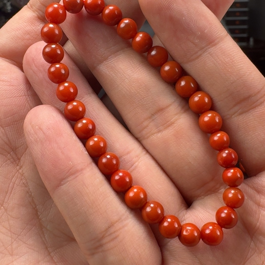 南红玛瑙柿子红双色圆珠手串6mm未镶嵌九***。