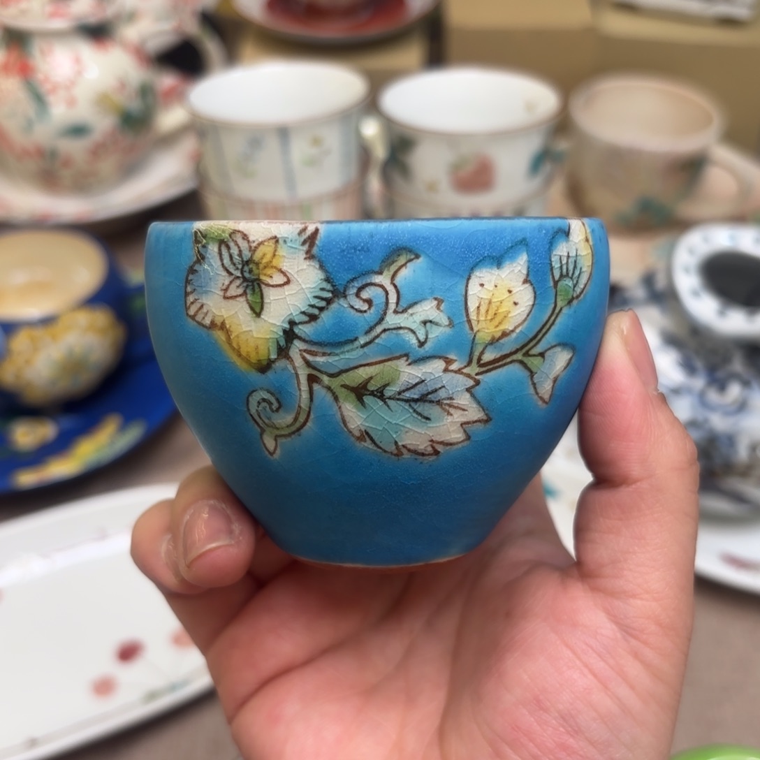 陶钱稻积佳谷 手握杯