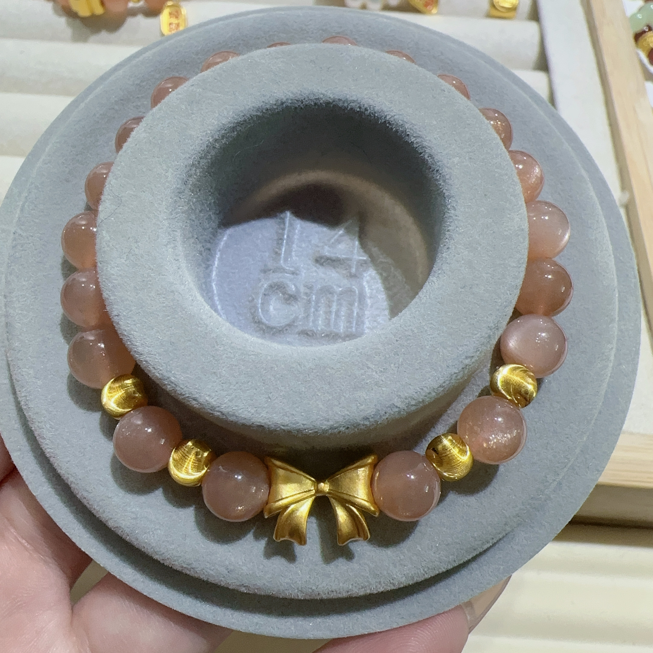 天然太阳石足金999蝴蝶结猫眼手链