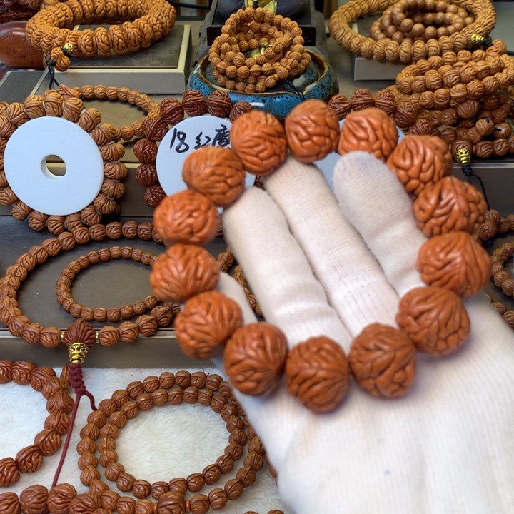 角***落桃核手串秦岭龙纹