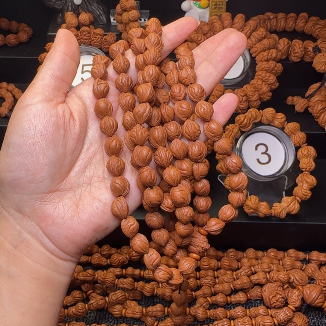 他***。桃核手串秦岭玉龙