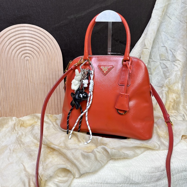 95新 Prada/普拉达 橘色贝壳手提斜挎包