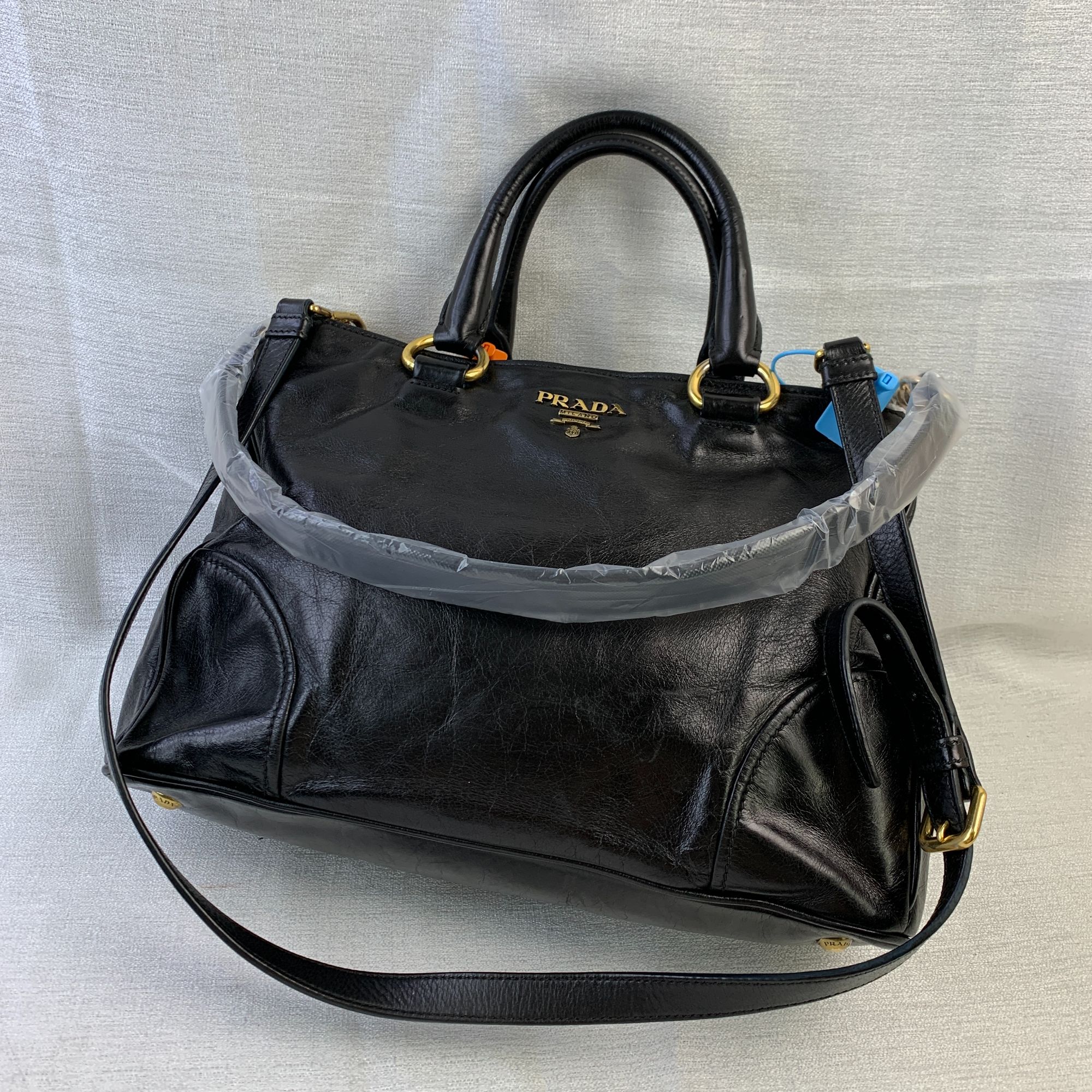 95新 Prada/普拉达 黑金手提机车包/EE10120016/0016/H