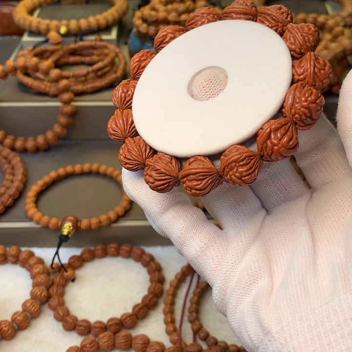 夏***蟹桃核手串秦岭龙纹