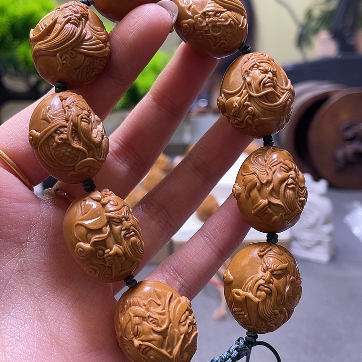 한***妈橄榄核吊坠橄榄核雕