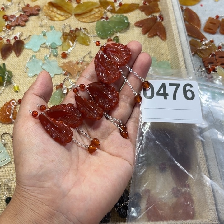 荣***店蛇纹石玉合金耳饰