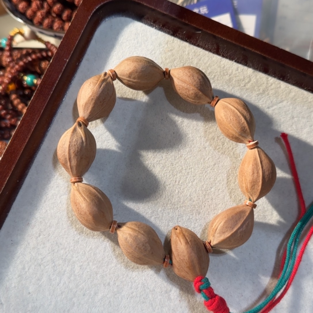 l***s橄榄核吊坠铁核手持