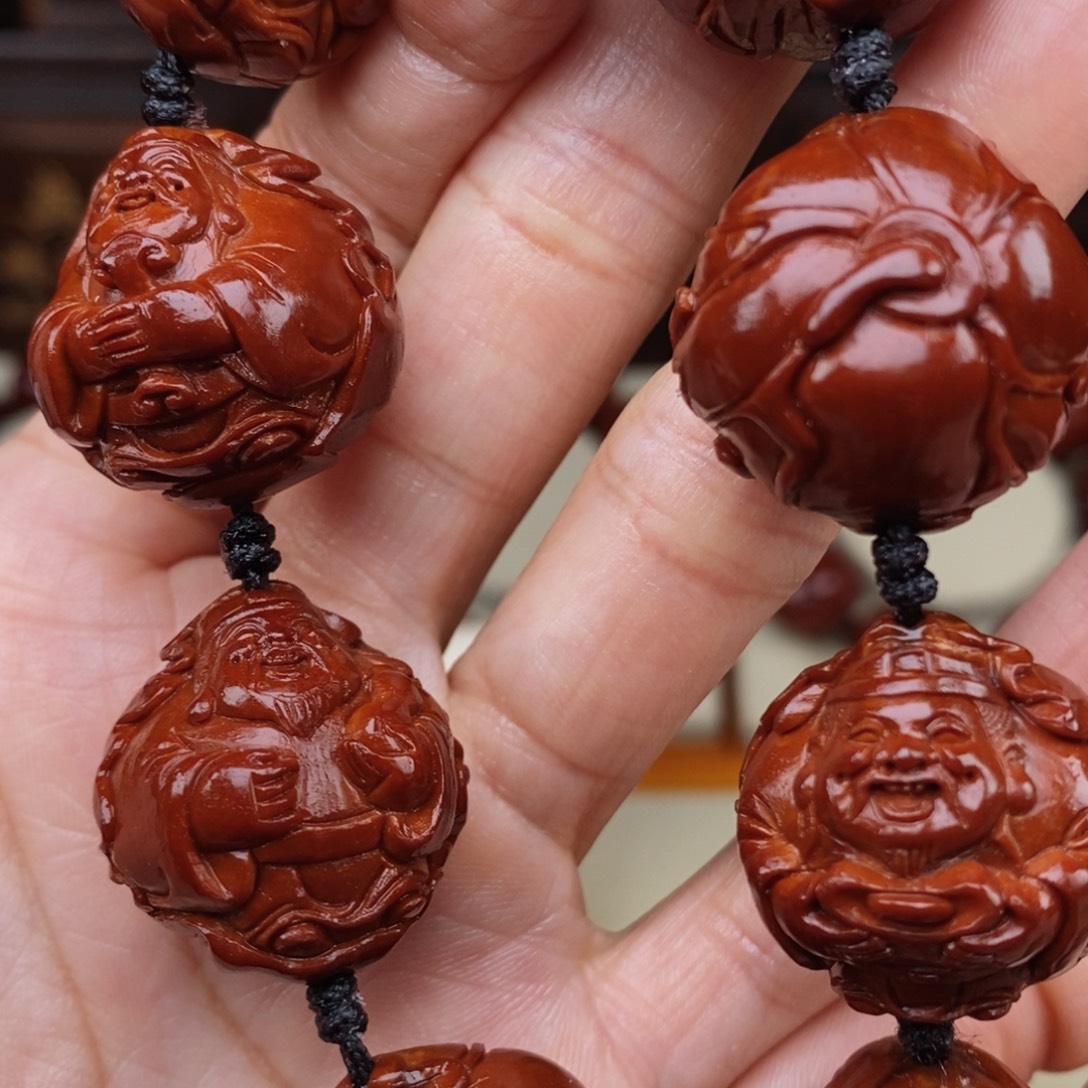 彬***2橄榄核吊坠荷叶财神