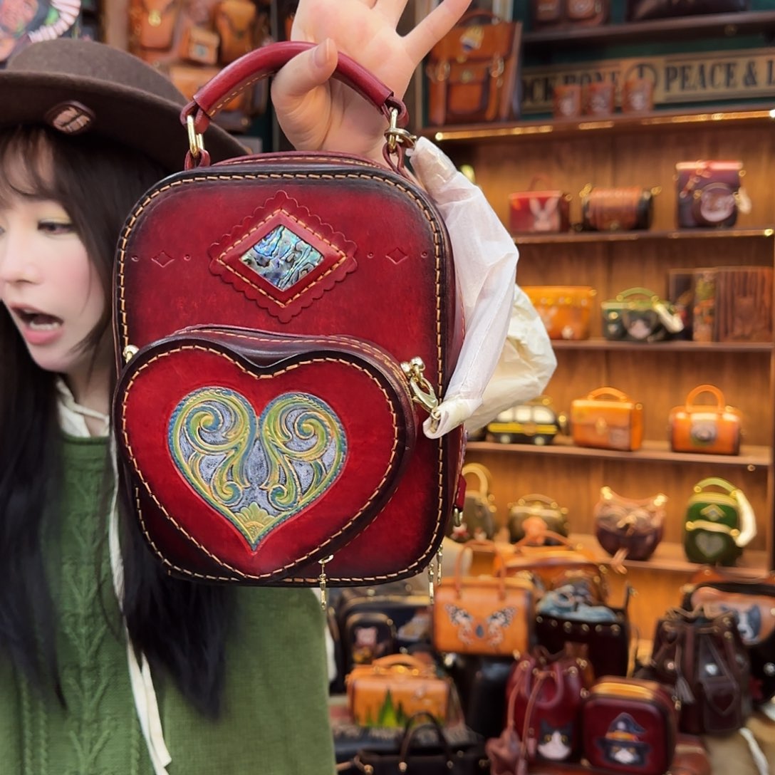 累***了牦牛剖层皮革仙临双肩包酒红1号