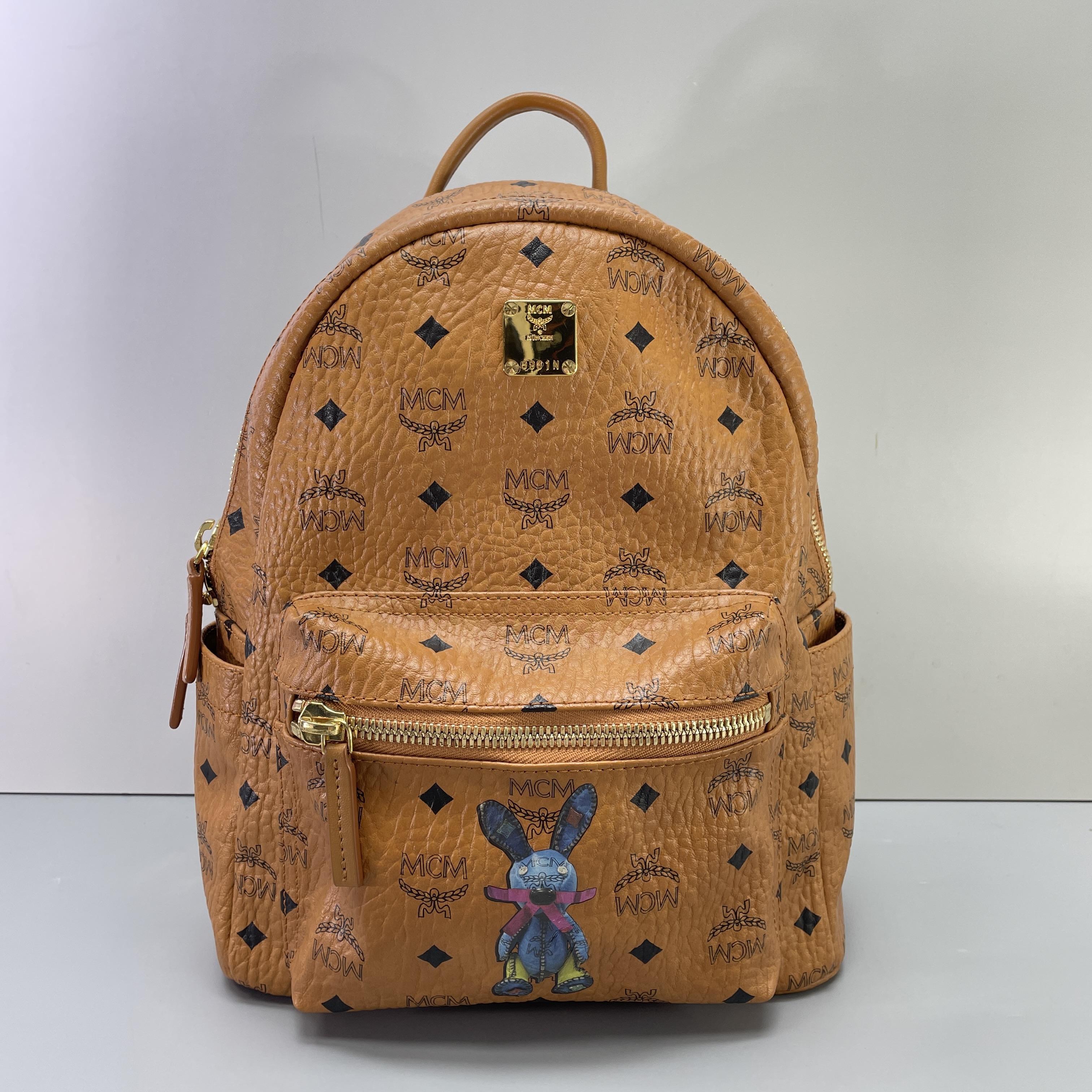 95新 MCM 媚姐/mcm干邑色兔子双肩包26x32x12cmG100403