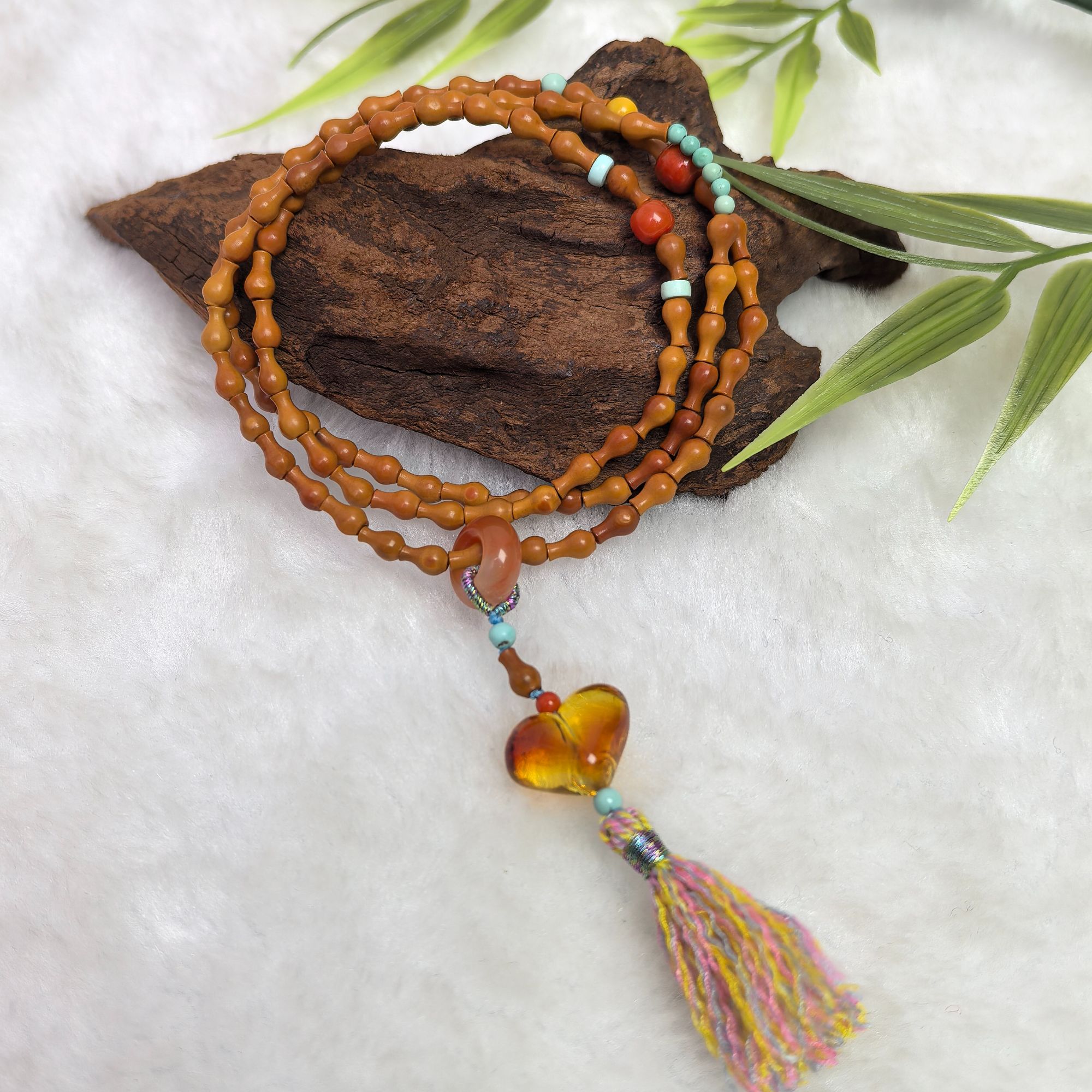 【蜜语】天然橄榄核宝瓶雕刻件三圈爱心流苏款