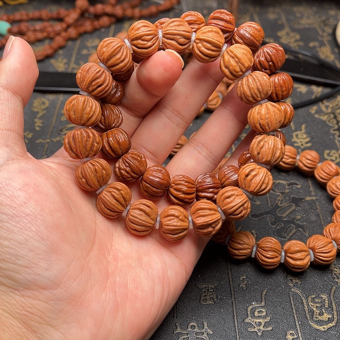 桃核吊坠佛手手串