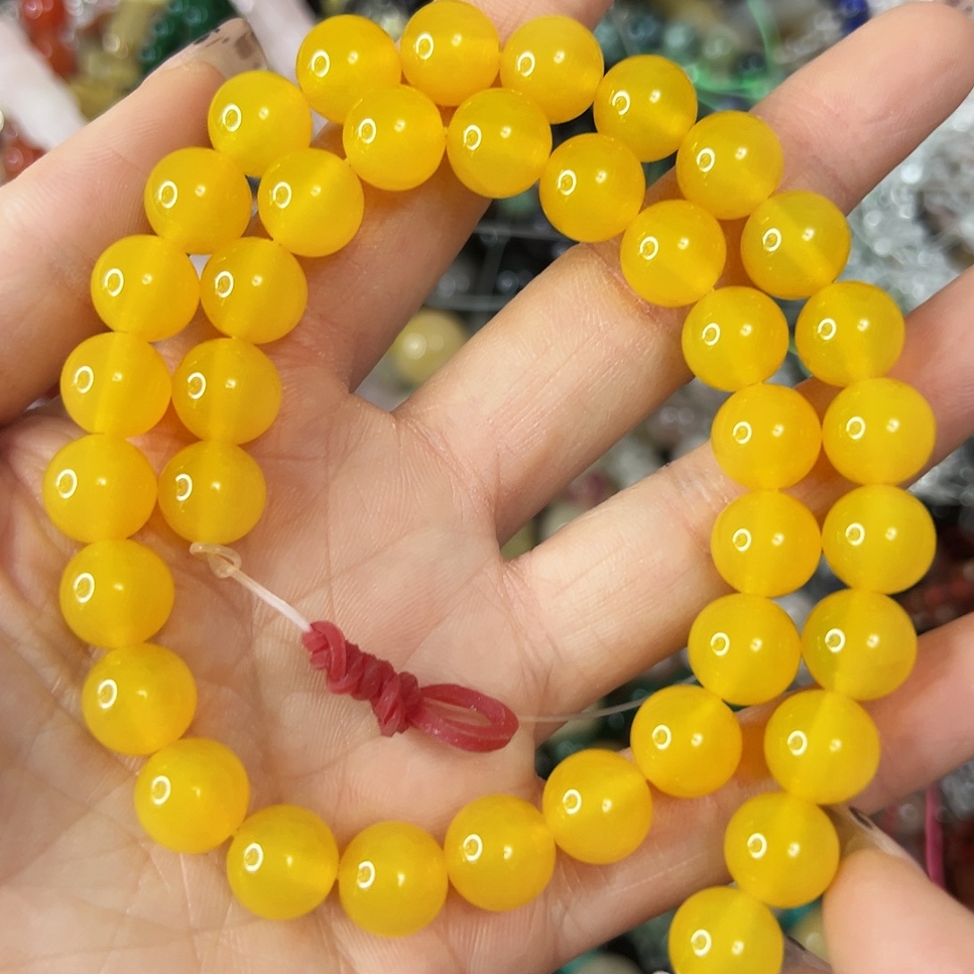 玛瑙/玉髓未镶嵌珠宝半成品，7A卡10鸡油黄玛瑙一条