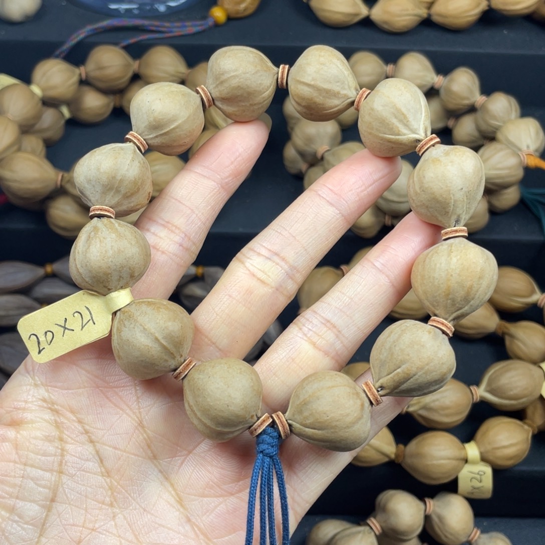 锋***༽001橄榄核三花蒜头20*21