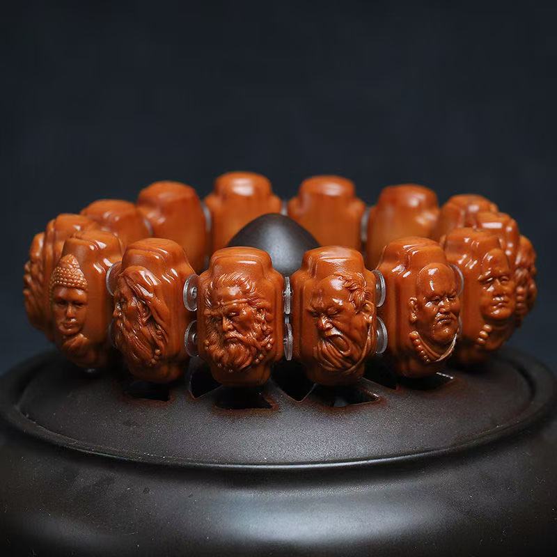 罗汉手牌橄榄核雕赵晋罗汉十二尊者