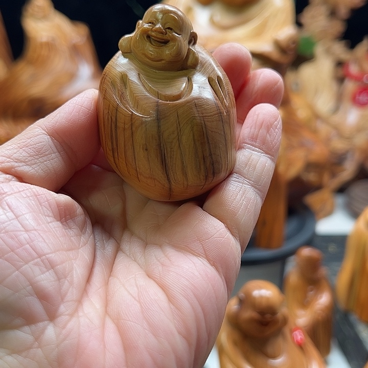 崖柏崖柏弥乐手把件