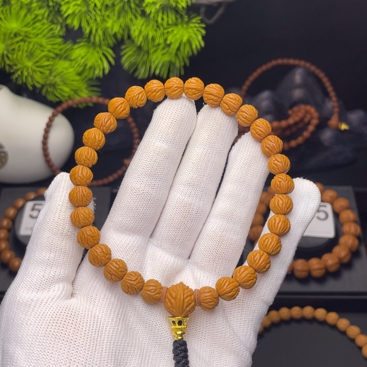 如***松吊坠桃核小金豆0.9