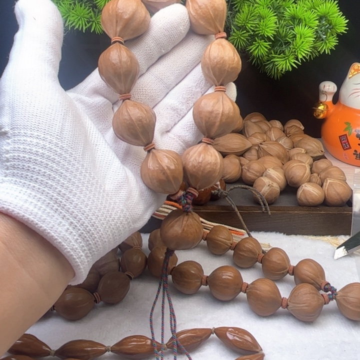 小***色橄榄核手串/手链2.5*2.6原皮四花铁核10颗