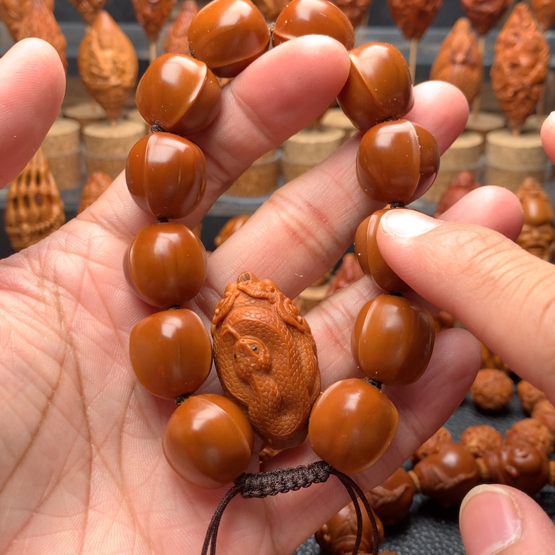 橄榄核吊坠胡**嗓橄榄核