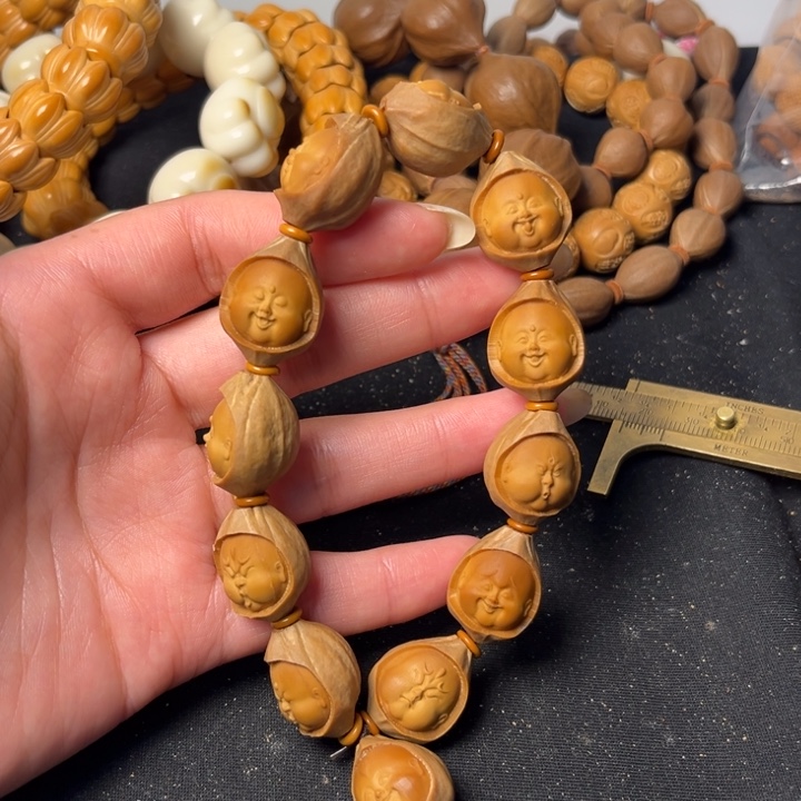 橄榄核吊坠包衣百态