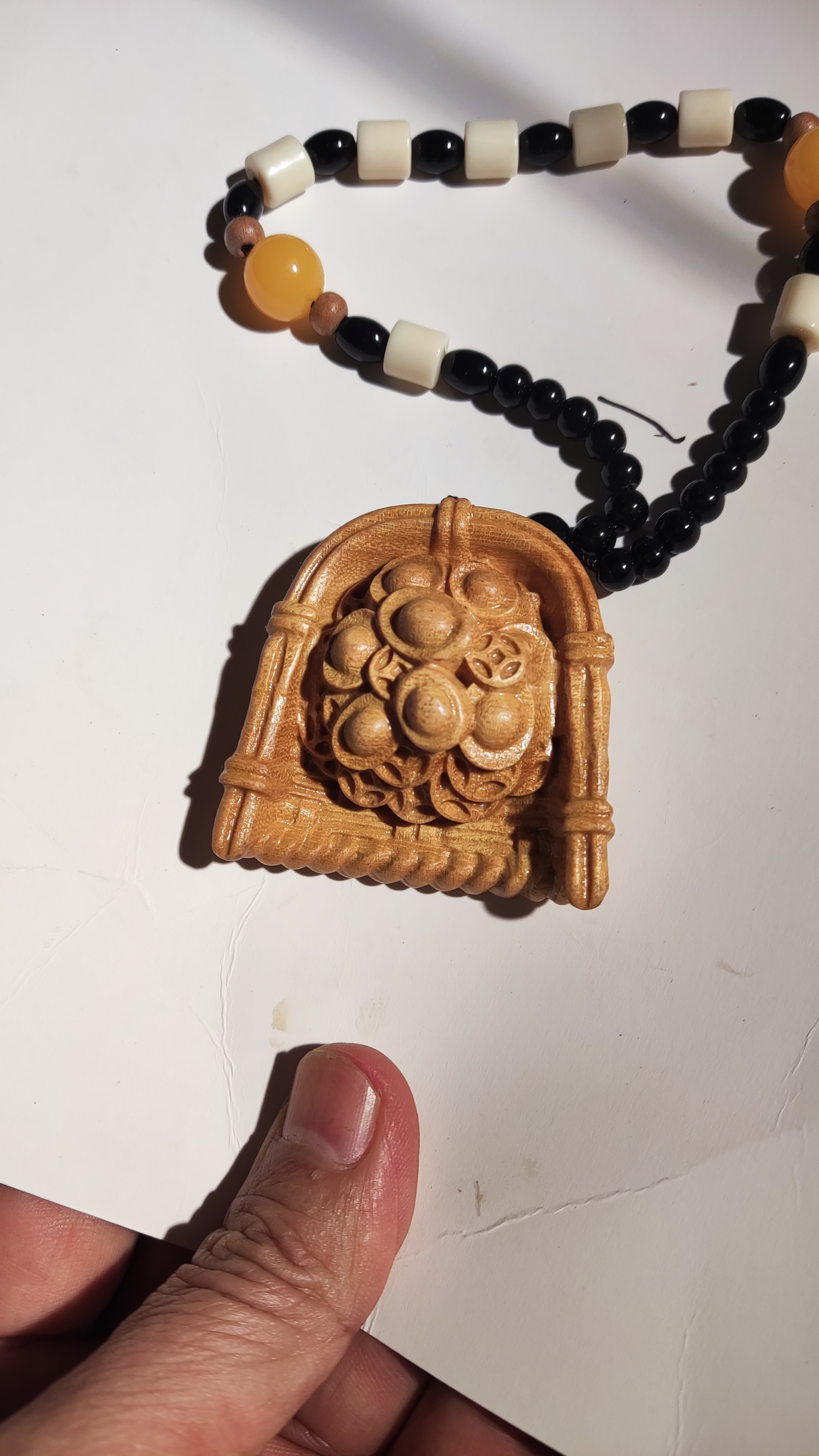 黄金木手把件，回财娜宝