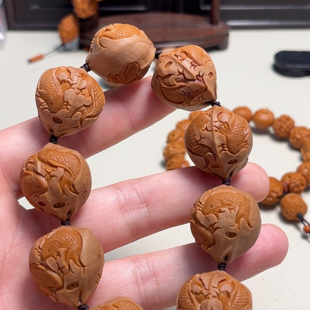 橄榄核吊坠用***旅双鱼戏莲