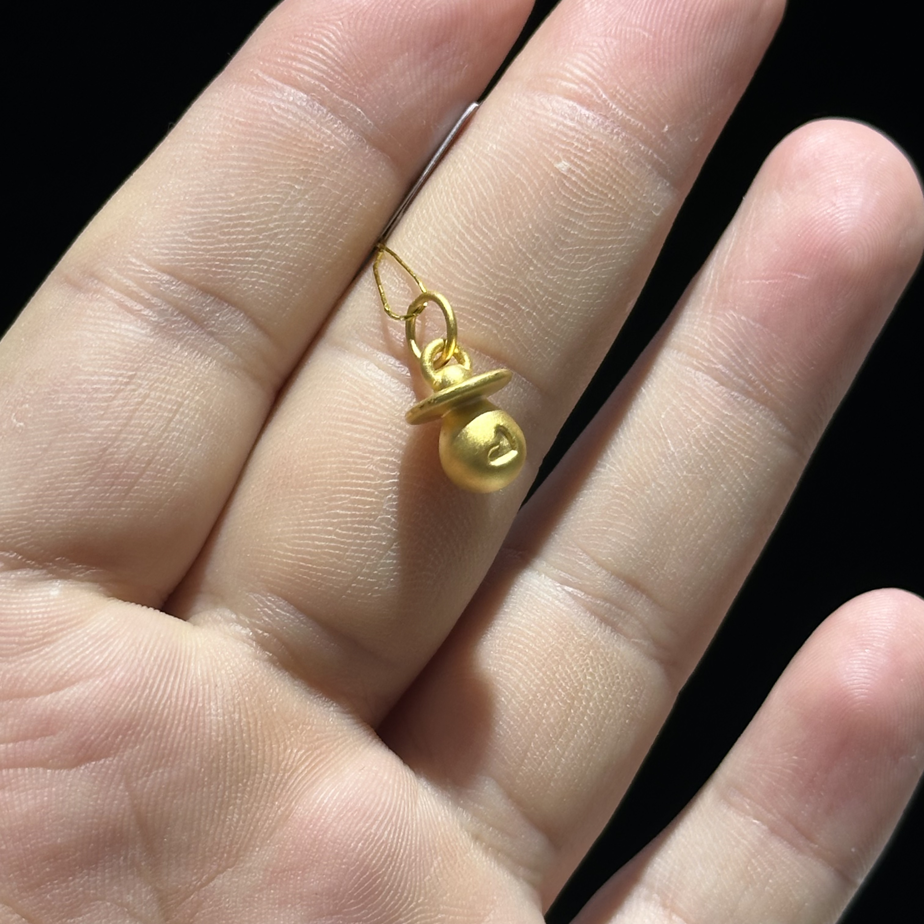 足金999 爱心奶嘴滴流 1.059