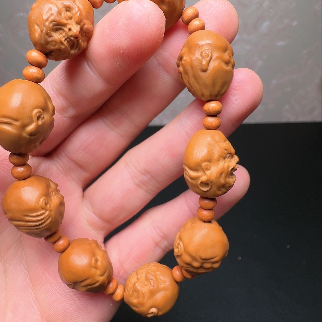 橄榄核手串退还给