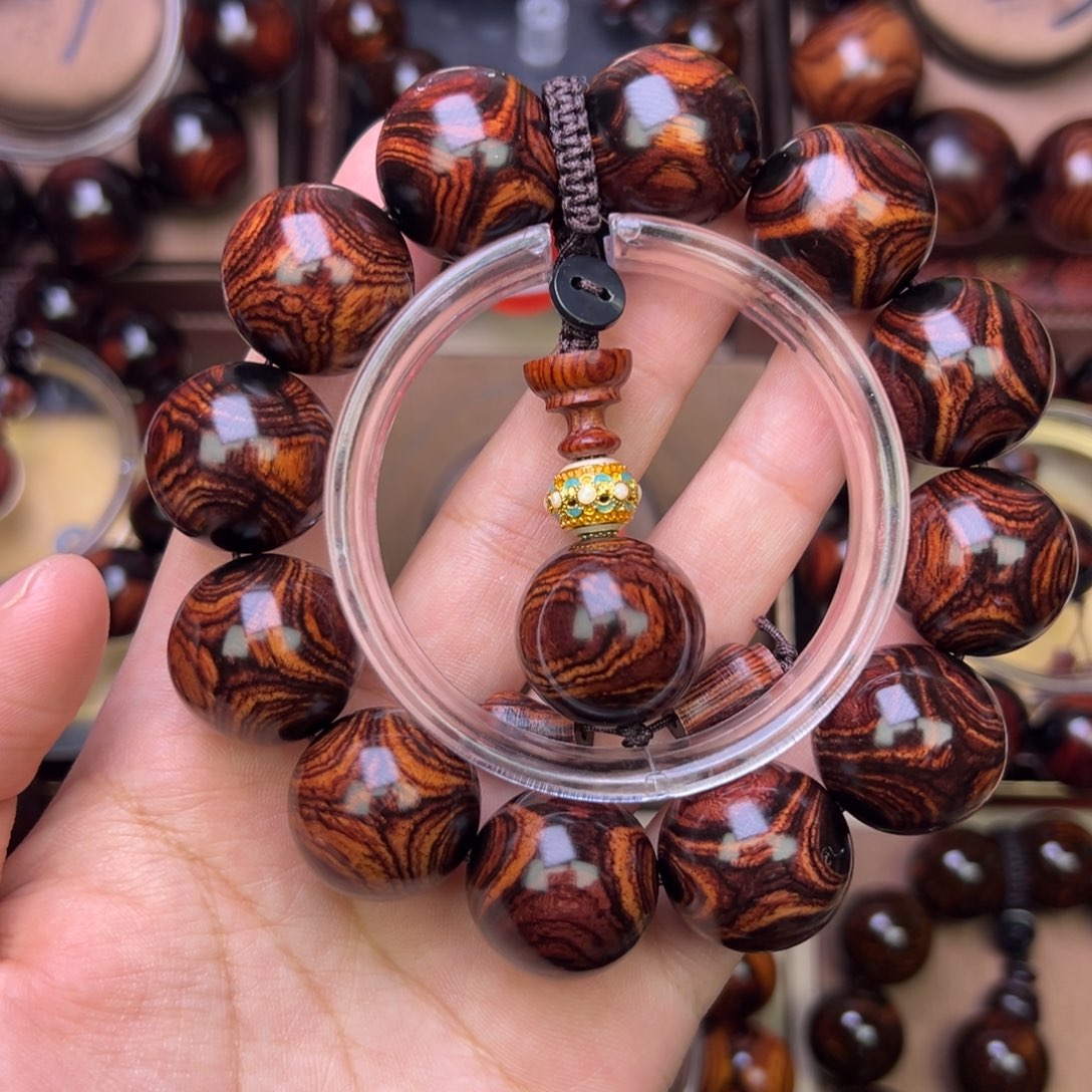 木质类黄花梨鬼脸对眼手串