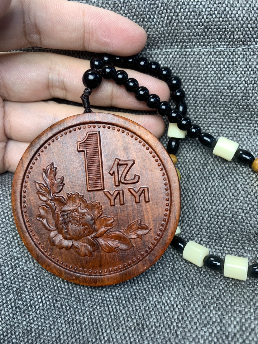 一个亿双面手把件