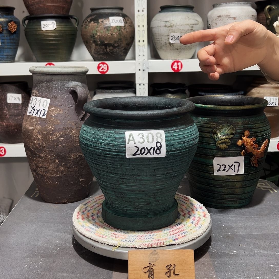 红陶绿鱼尾有孔有孔