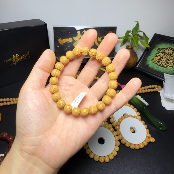 雍***瞒桃核手串精品野生桃核手串