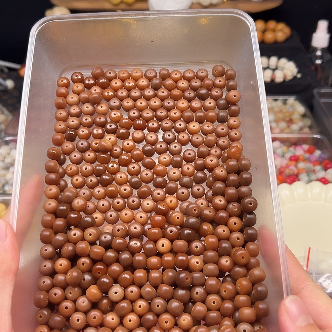 ****y菩提根/象牙果手串娄底瑕疵咖色药片